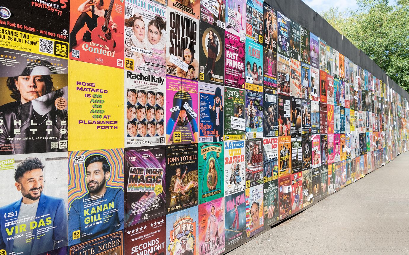 Colourful wall of Edinburgh Fringe posters