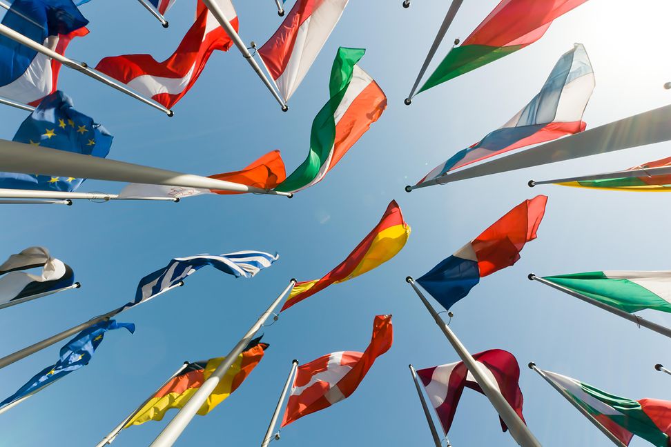 Flags against blue sky