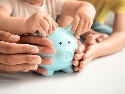 Family with piggy bank at a table